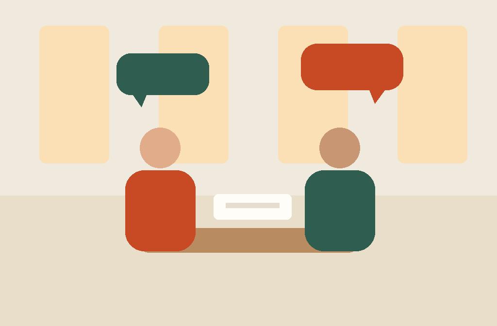 Teacher coaching a student one-to-one across a table